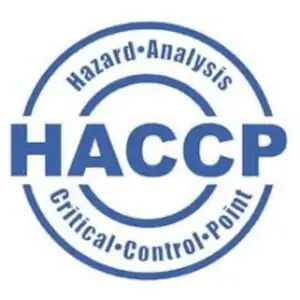 Круглый синий логотип HACCP (Hazard Analysis Critical Control Point) с текстом "Hazard Analysis" и "Critical Control Point". Этот знак подчеркивает необходимость использования пневматической арматуры и компонентов из нержавеющей стали, соответствующих высоким стандартам безопасности и гигиены для пищевых мельниц